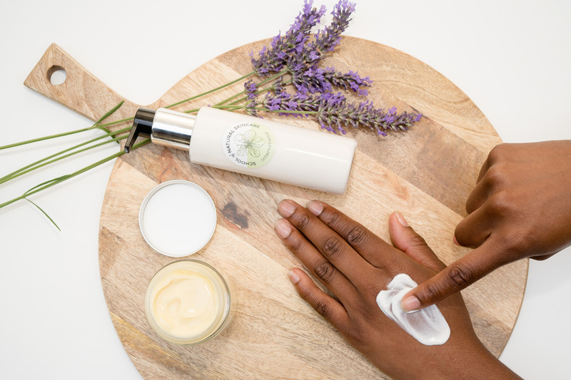 Applying lavender lotion on hand