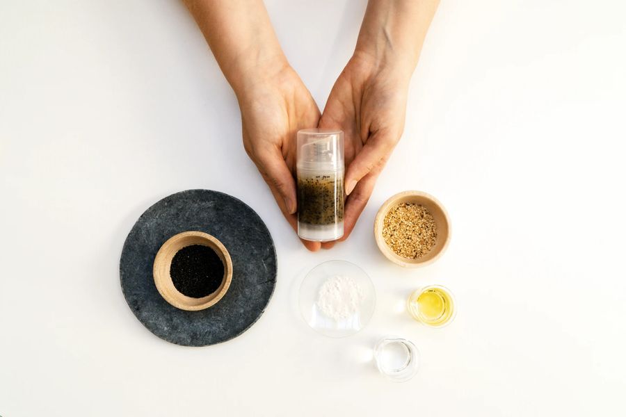 Hands holding skincare ingredients on white background