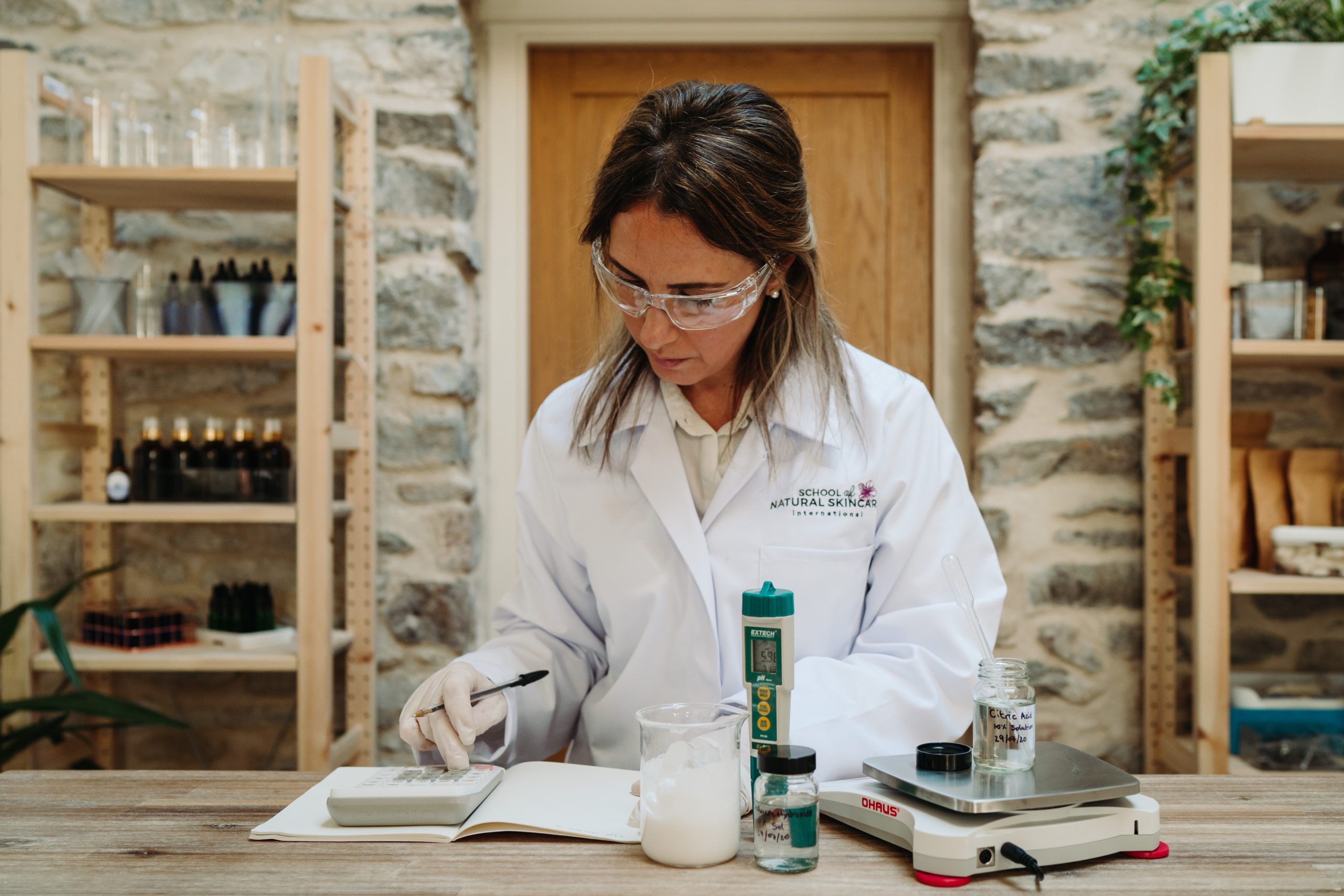 Woman conducting skincare research in a lab