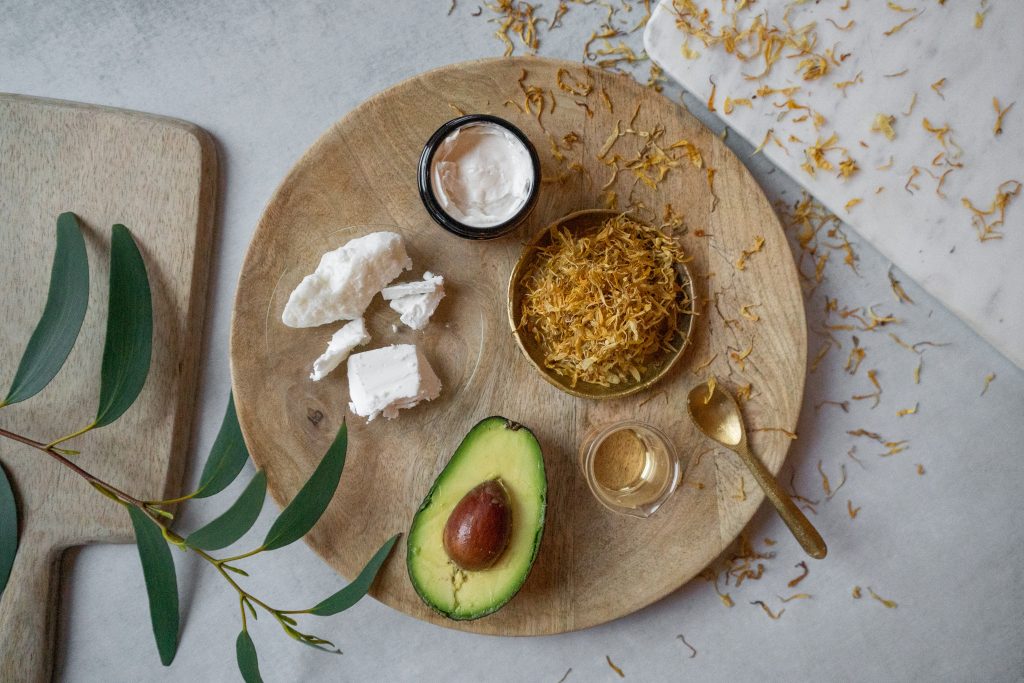 Natural skincare ingredients on wooden board