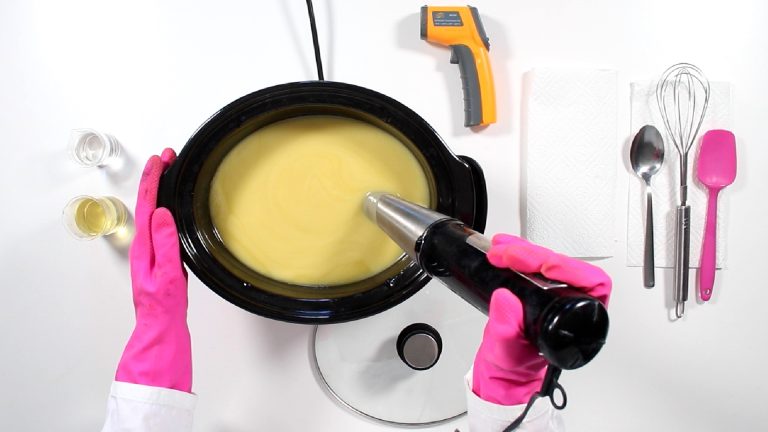 Making soap in a crockpot with tools and ingredients.