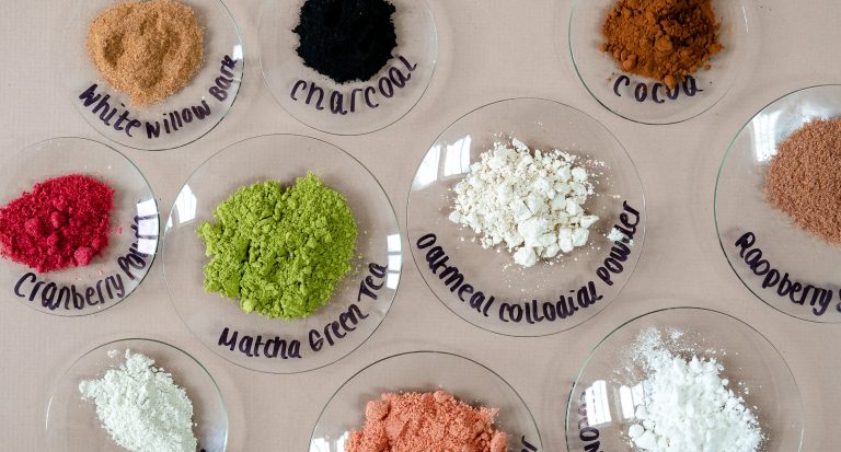 Natural powders on labeled glass plates.