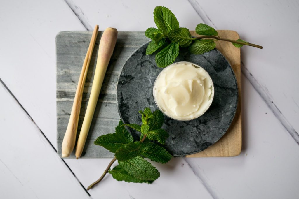 Lemongrass, mint, and cream on marble board