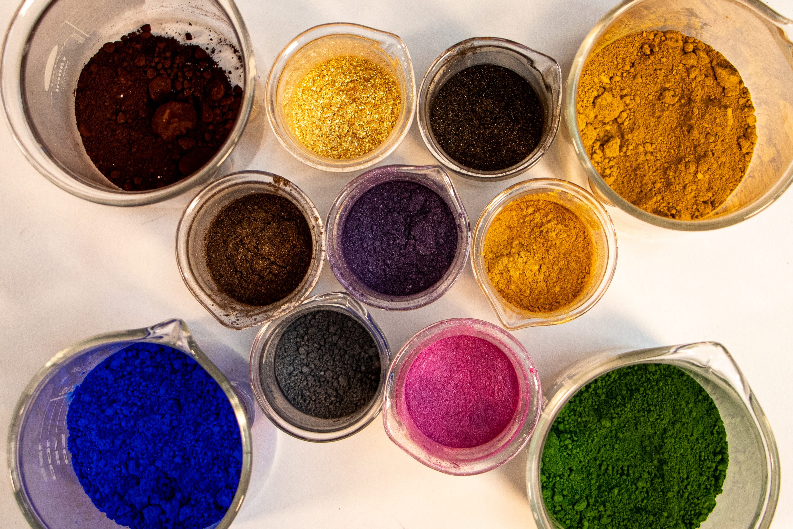 Colorful pigment powders in glass containers