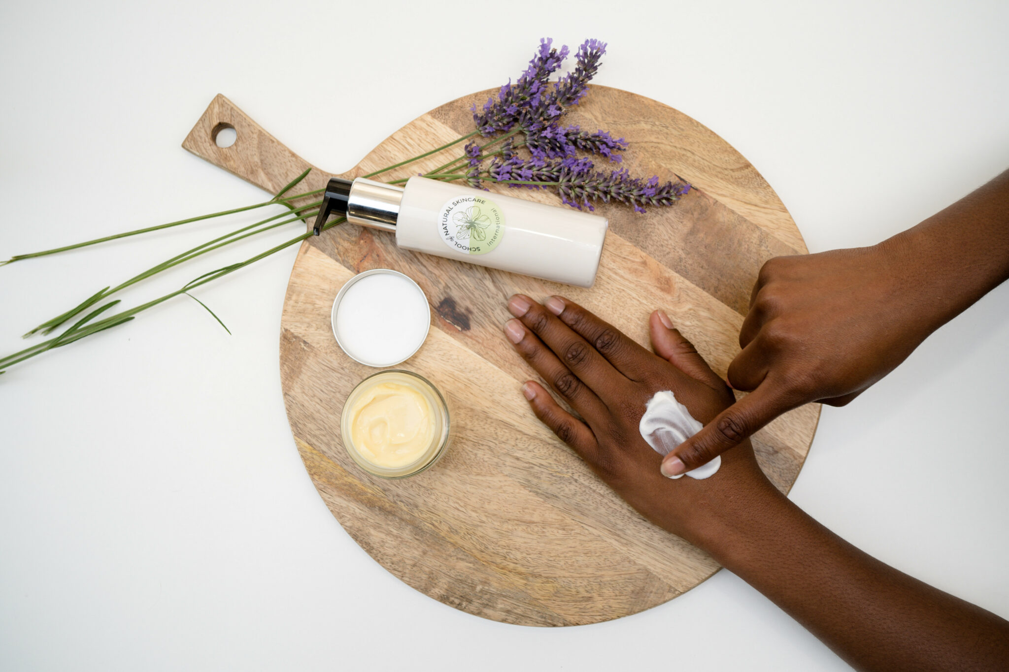 Applying natural hand cream with lavender on board.