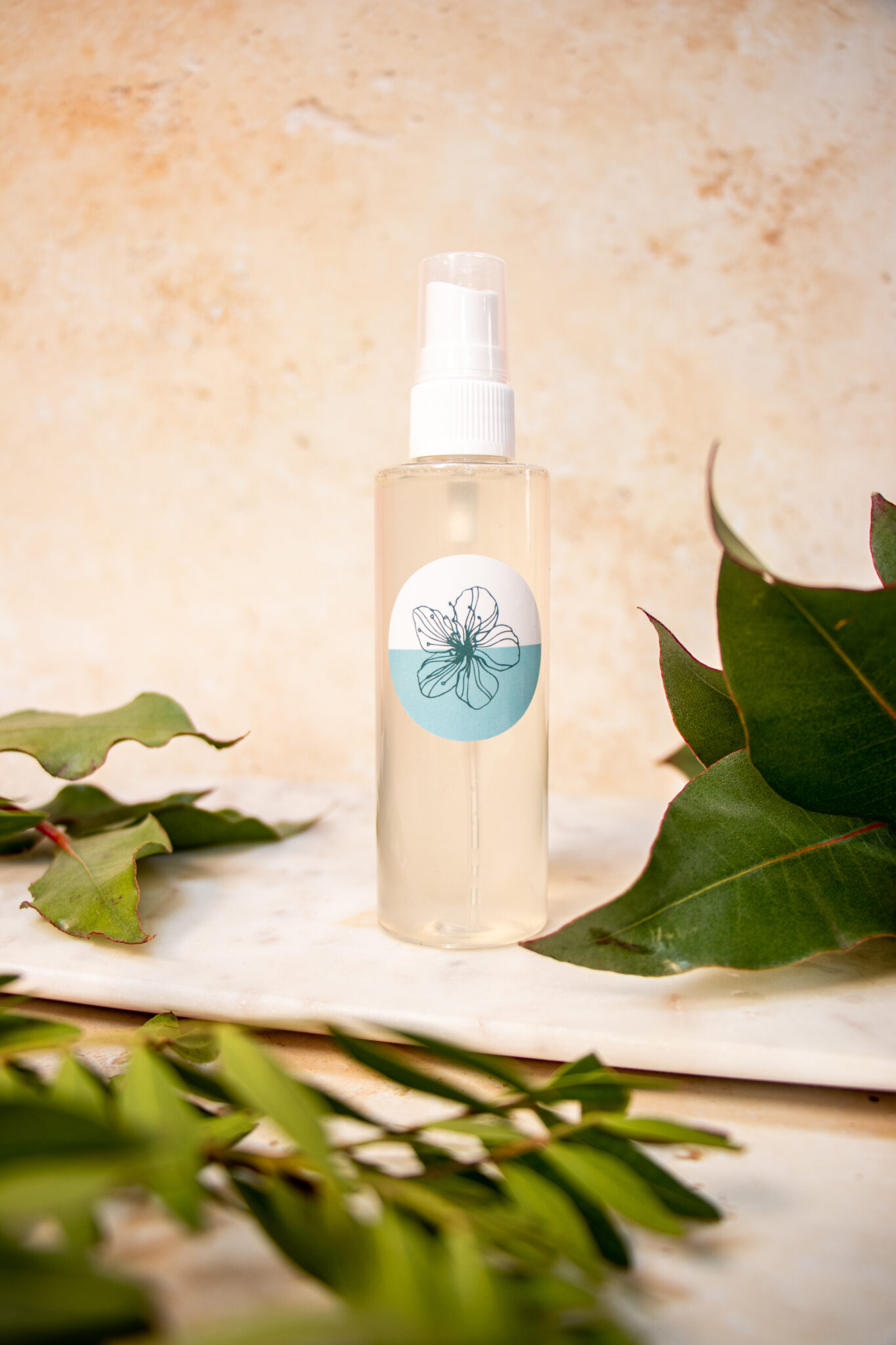 Natural spray bottle with botanical elements