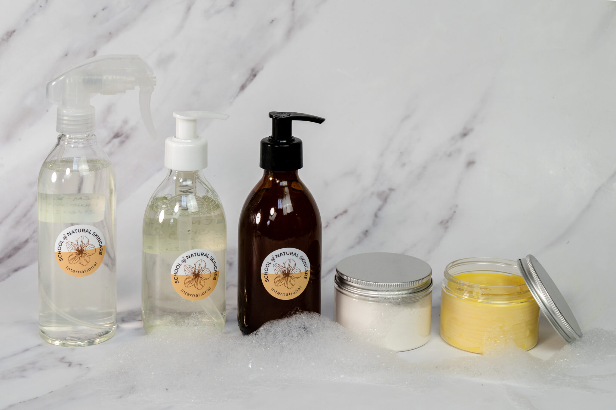 Natural skincare products on marble surface