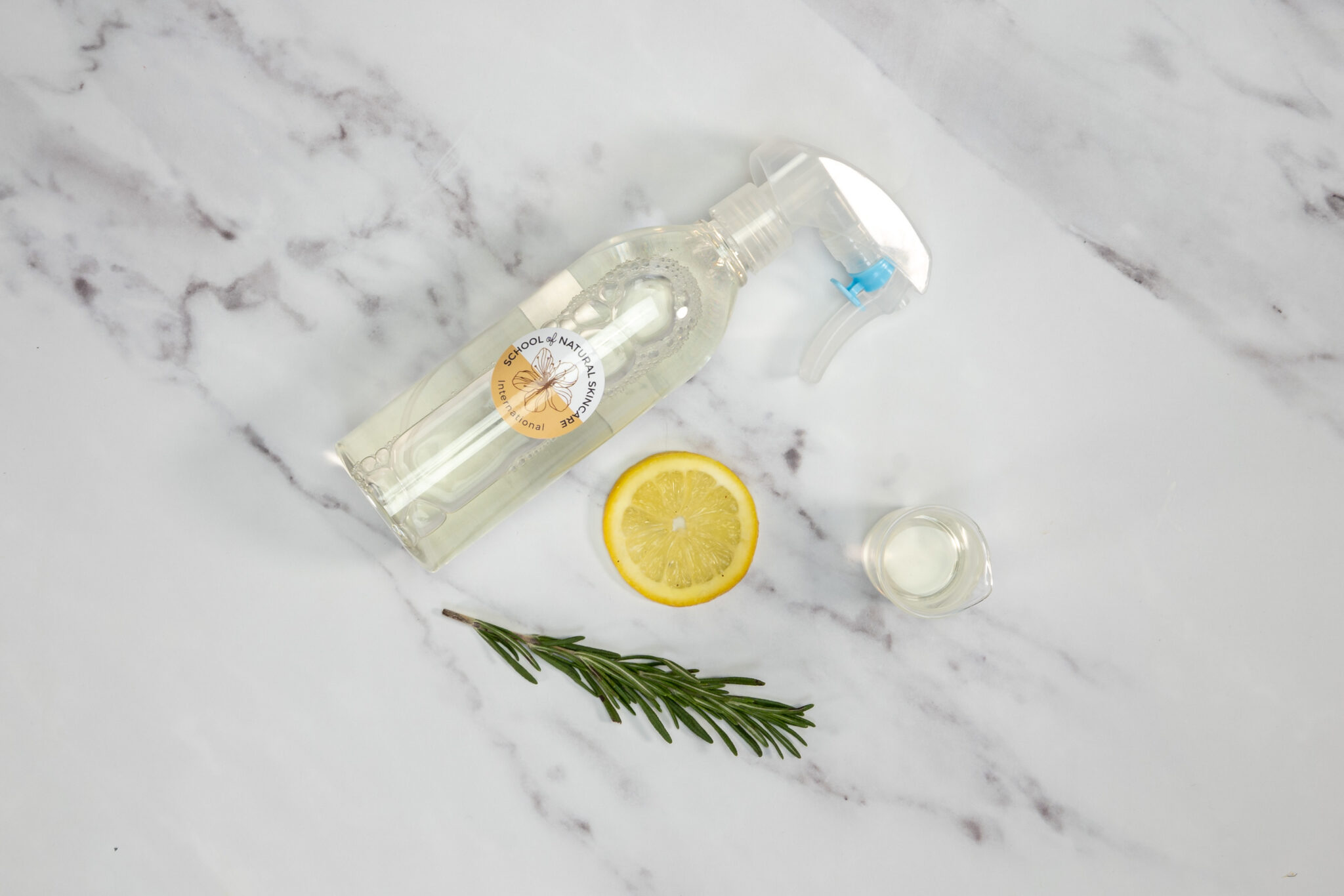 Natural cleaning spray with lemon and rosemary