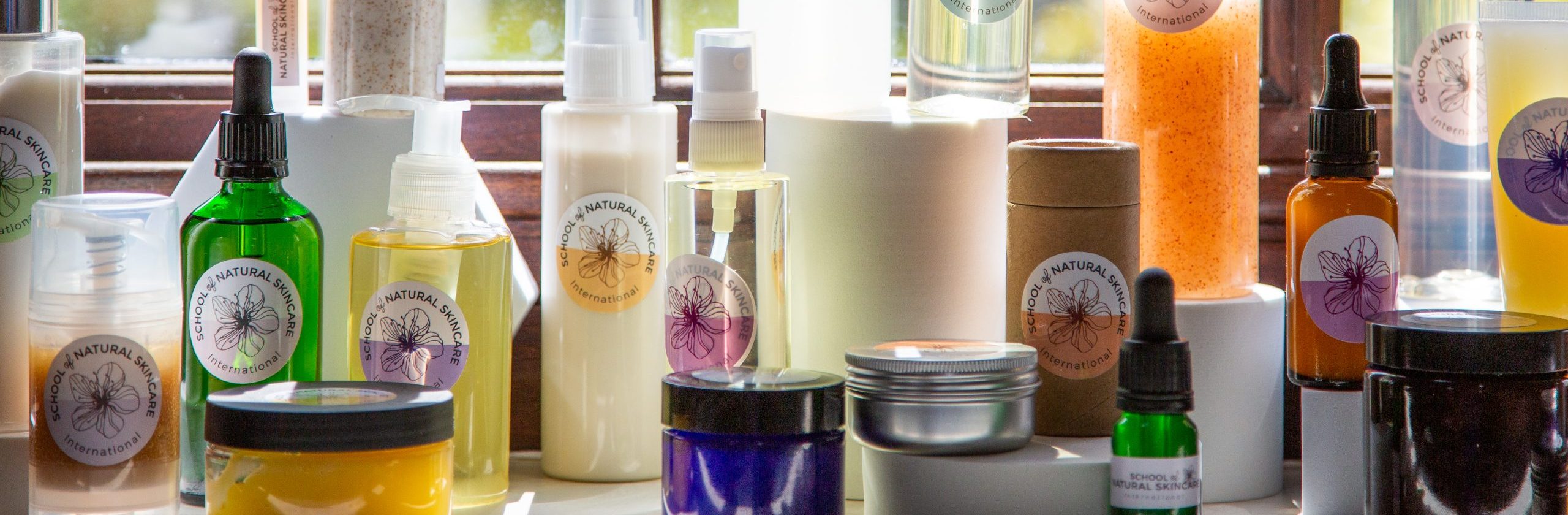 Collection of natural skincare products on a shelf.