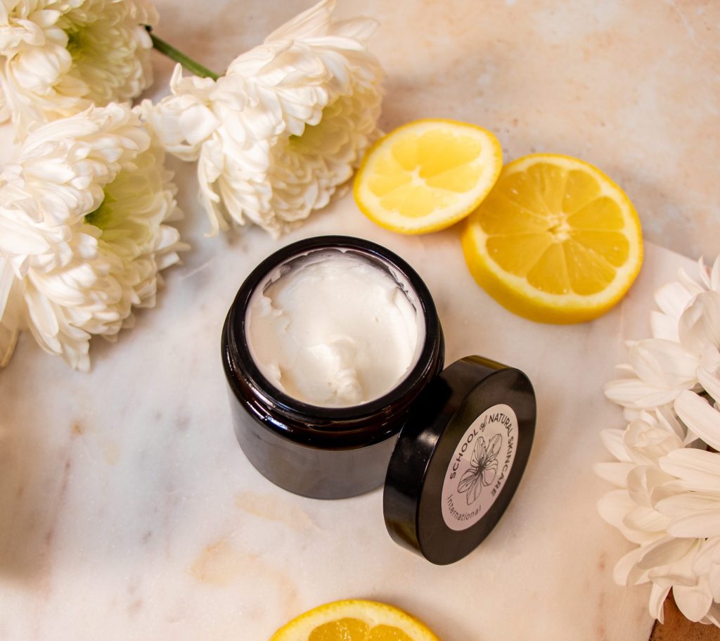 Natural cream with chrysanthemum flowers and lemon slices