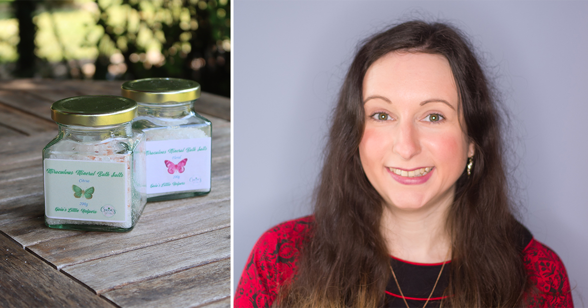 Jars of bath salts beside smiling woman.