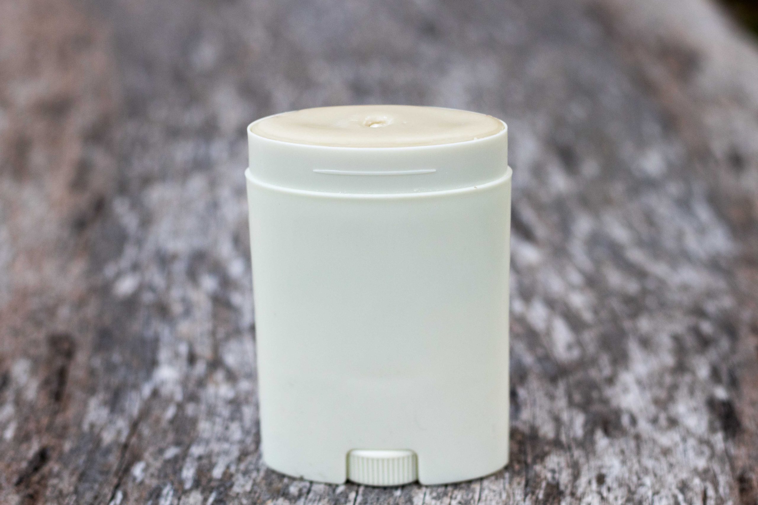 White deodorant stick on wooden surface