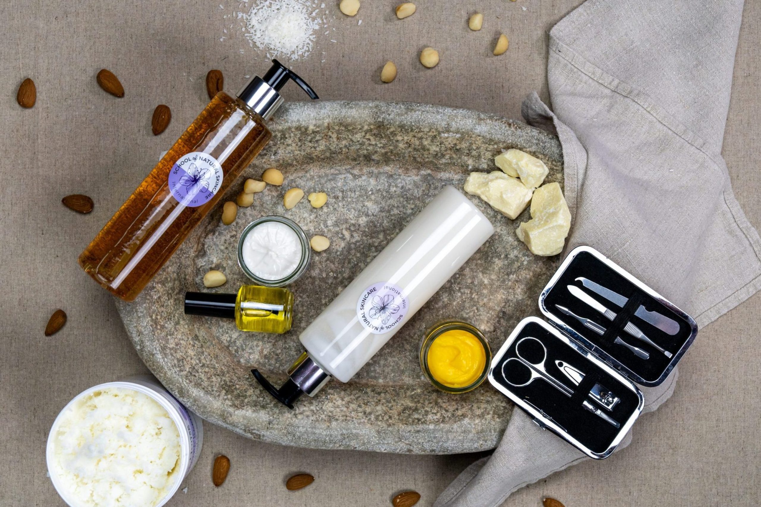 Natural skincare products with almonds and grooming kit.