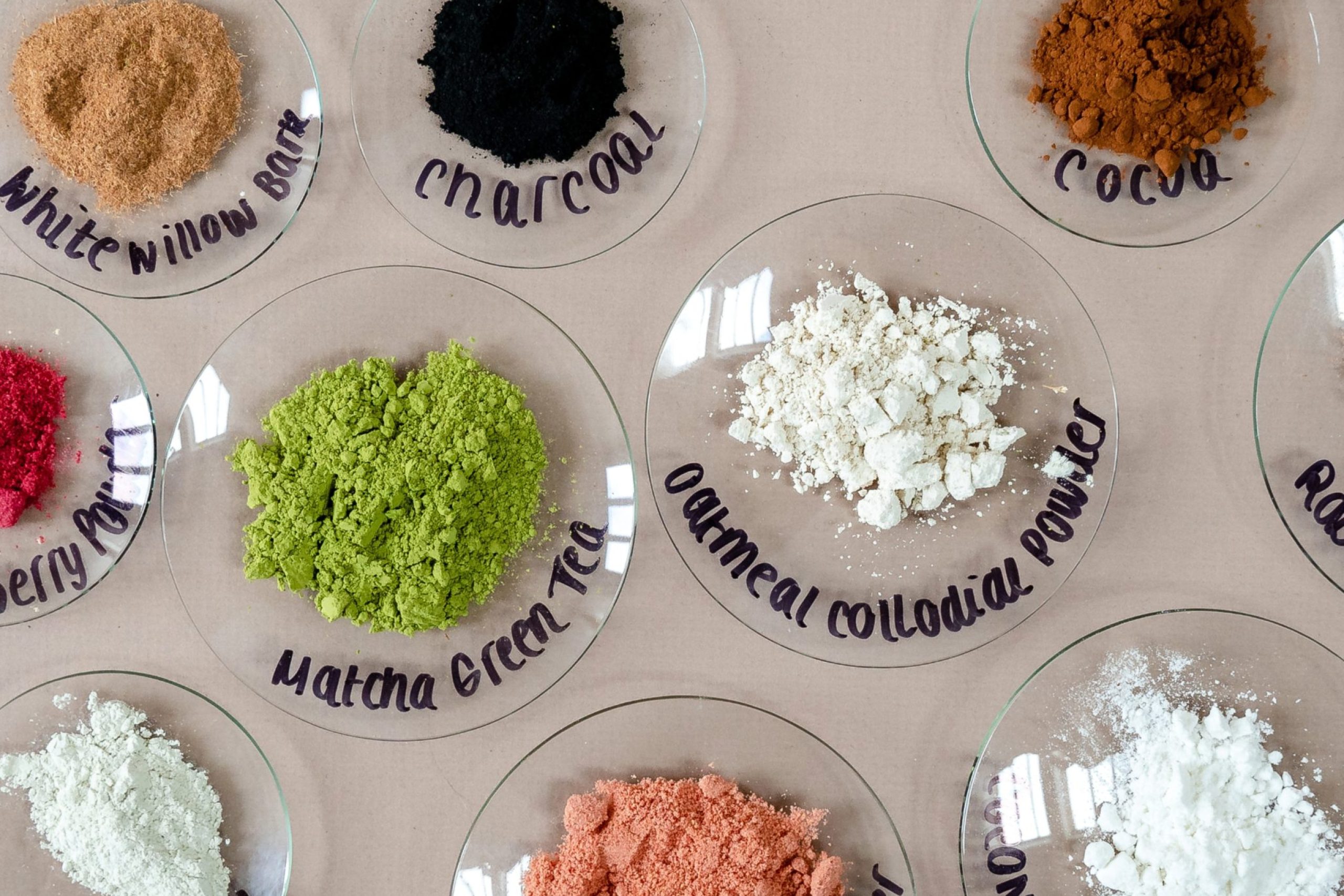 Natural powders on labeled glass plates.