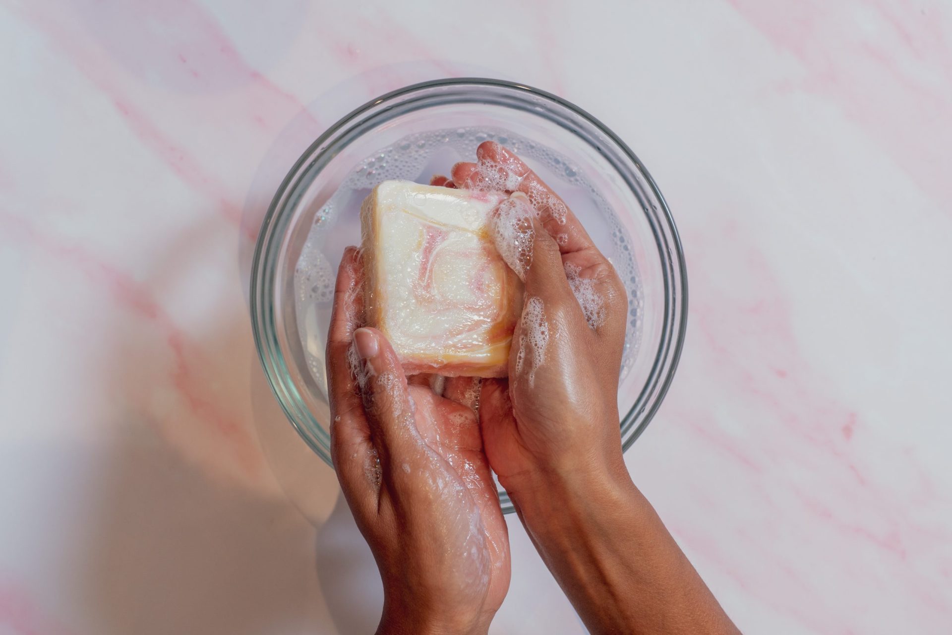 Hands washing a bar of soap